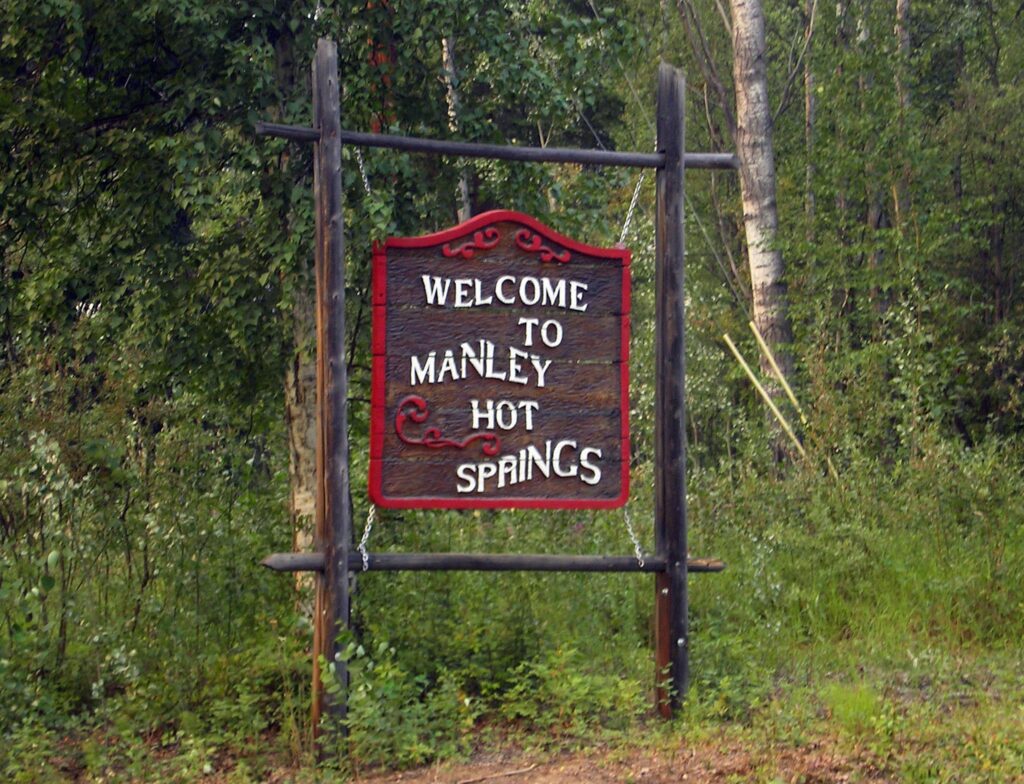 The welcome sign greets you as you enter Manley Hot Springs. Photo by: James Brooks
