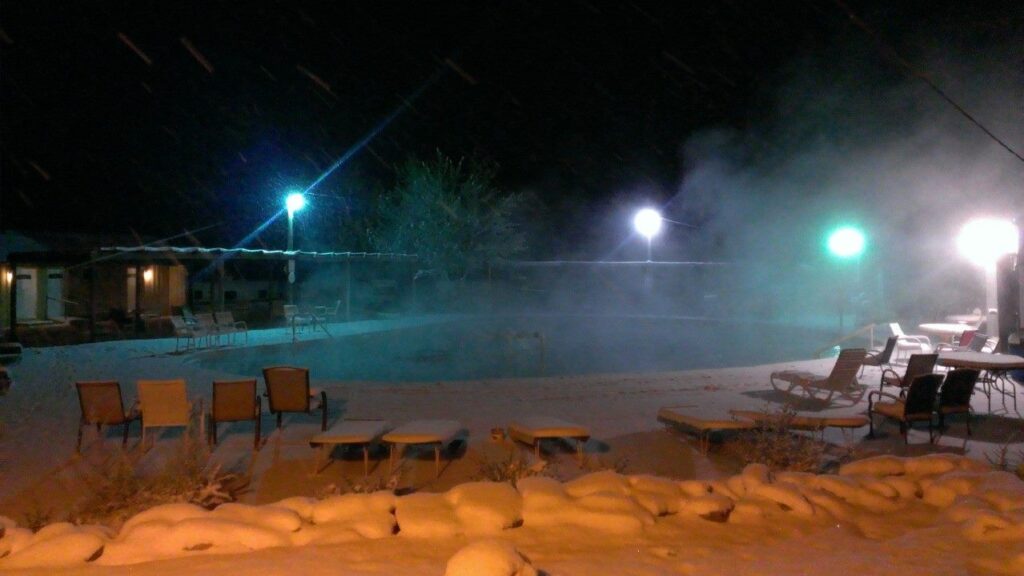 Pool by night at Dakota Hot Springs – Penrose, CO (Clothing Optional Resort)